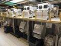 Vier FAUDI Druckbandfilter nebeneinander in Produktionshalle